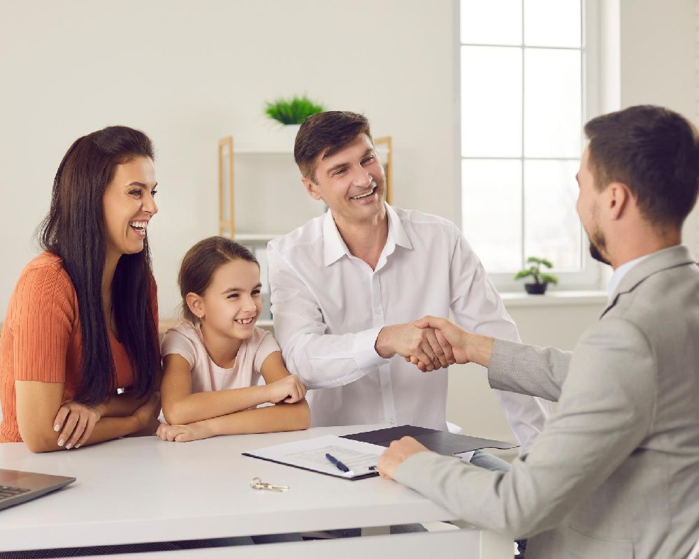 family with insurance agent